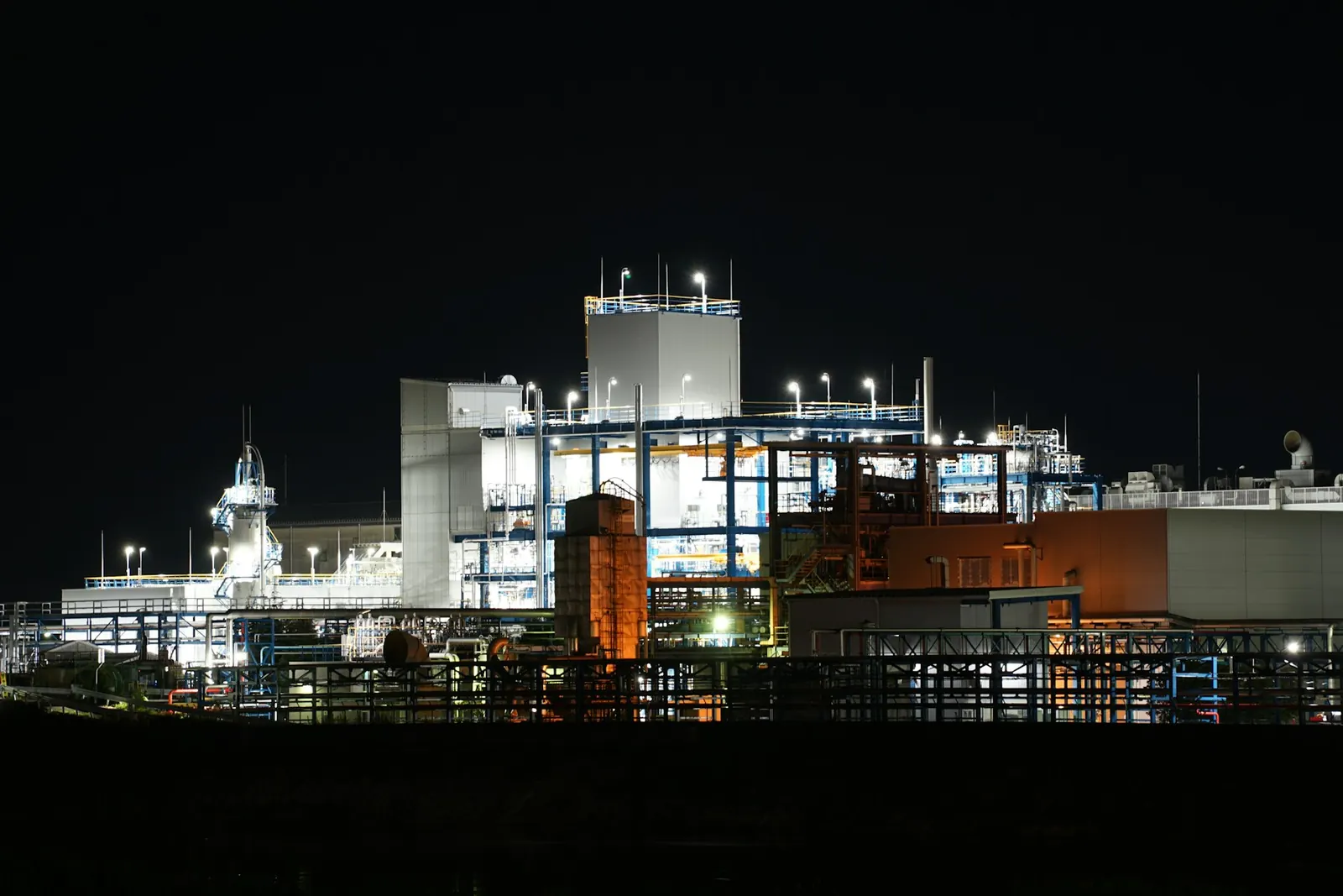 An industrial plant lit up at night